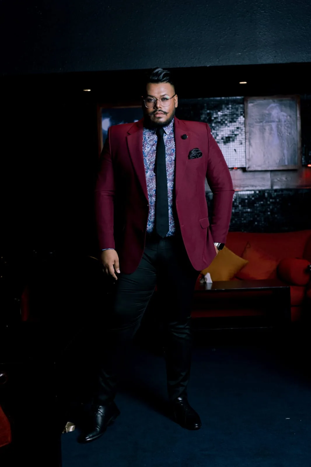 Burgundy formal suit styled for a distinctive look